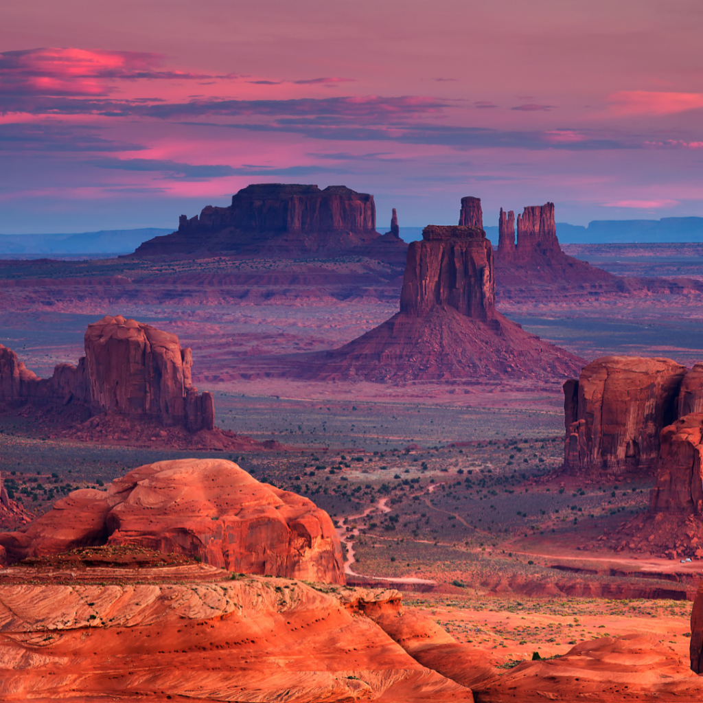 image of the Four Corners national park in USA, including monument valley at sunset with reds, oranges and purple tones